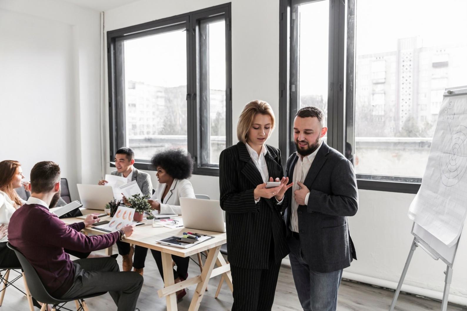 Financial documents and calculator showing business cost analysis work